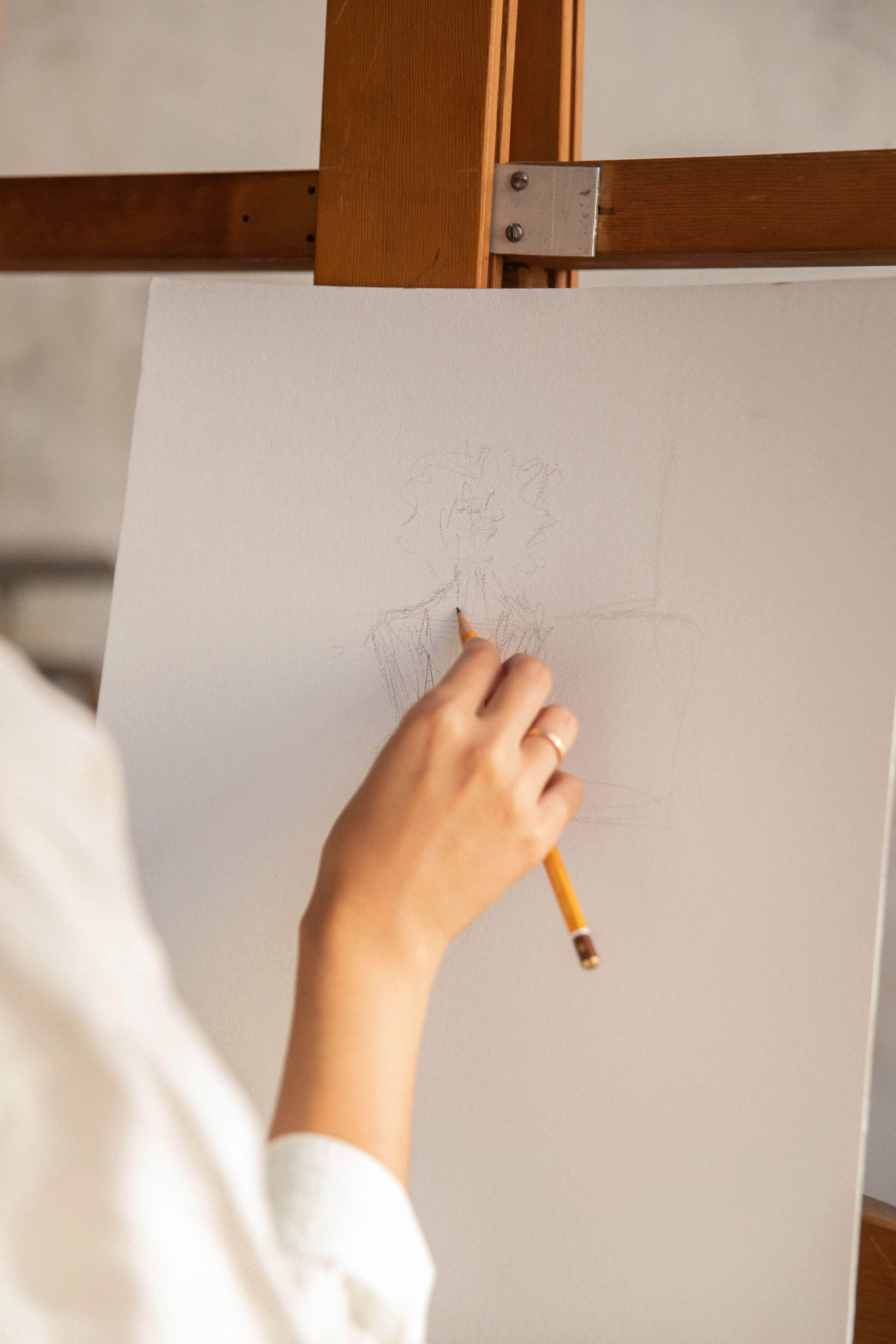 Person drawing on white paper