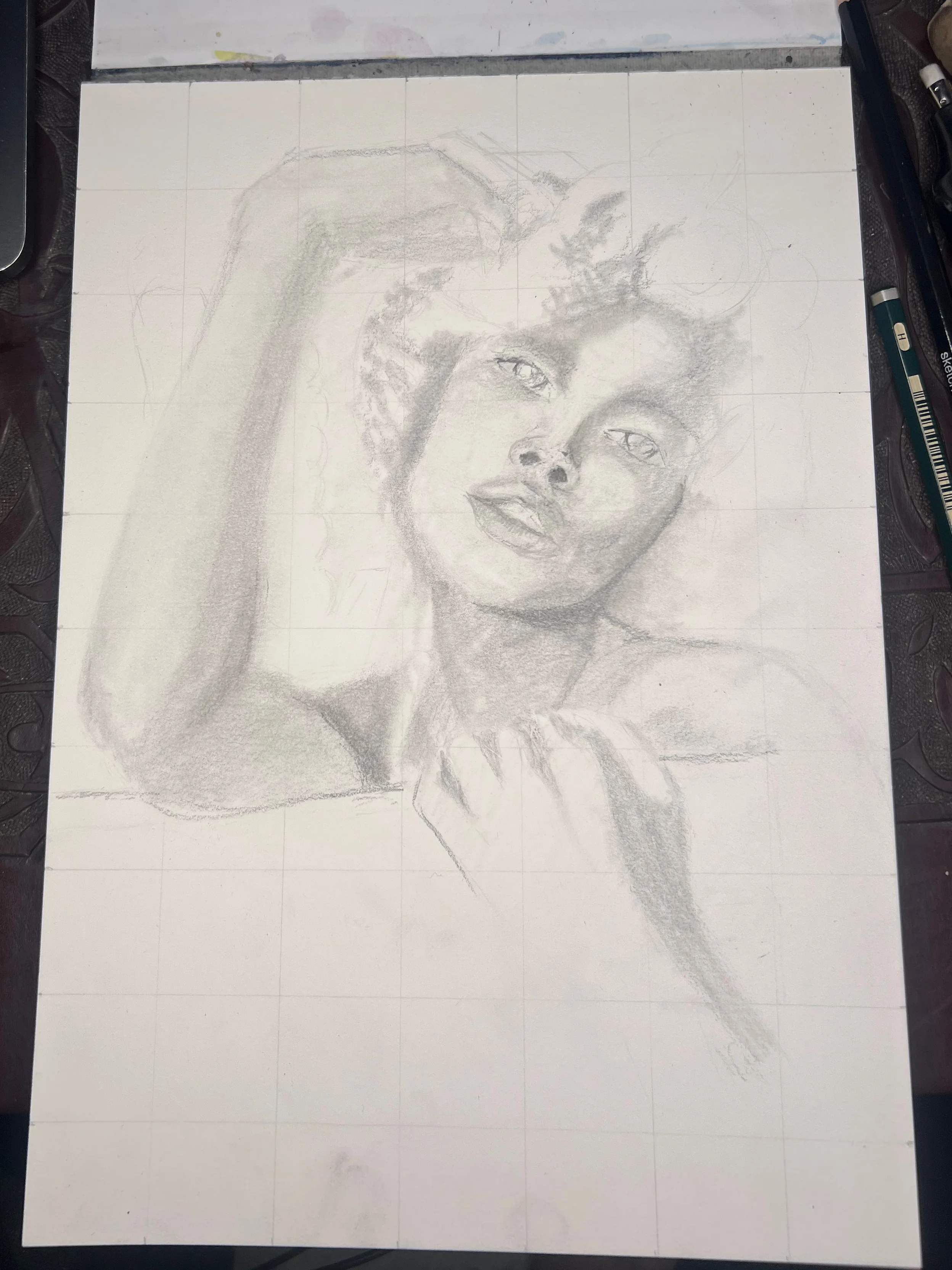 Close-up detail of the portrait drawing showing refined shading and edges